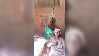 Village woman masturbating in her room while taking to her friends outside