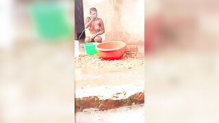Beautiful girl bathing in the rain