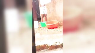 Beautiful girl bathing in the rain