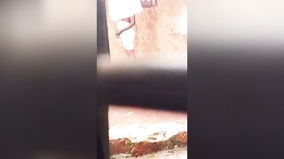 Beautiful girl bathing in the rain